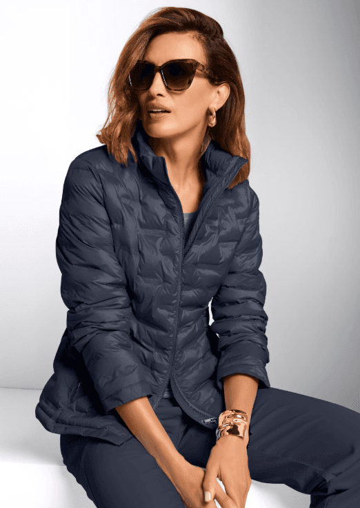 Navy quilted jacket worn on model